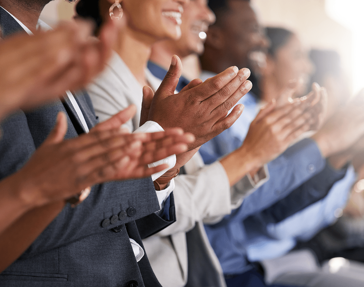 People clapping at an event